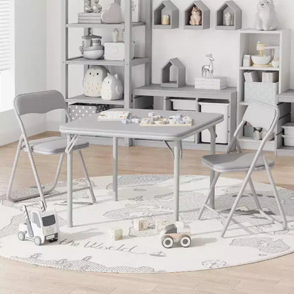 Ensemble table et deux chaises pliantes pour enfants, avec coussins en PU, facile à ranger, idéal pour les repas, la lecture et les jeux des enfants.