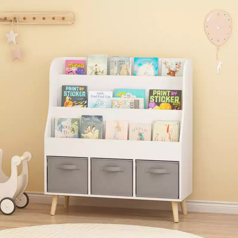 Bibliothèque Whisen Kids avec 3 bacs de rangement en tissu, présentoir de livres, porte-revues à l'avant avec pieds en pin - Blanc
