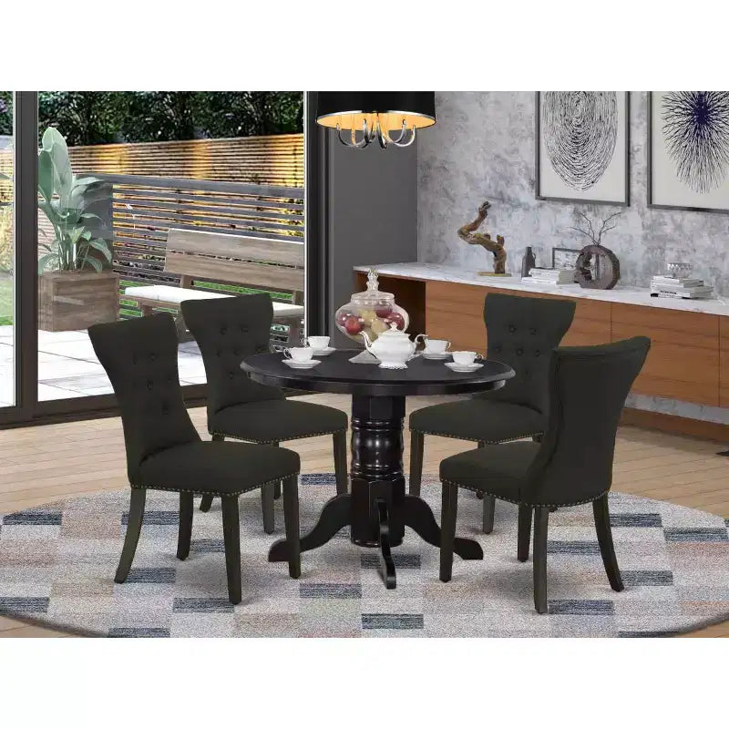 Ensemble de salle à manger HomeStock 5 pièces avec table ronde plateau en bois massif finition noire et 4 chaises rembourrées